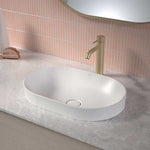 Caroma Liano II white pill inset basin on a vanity top, shown in a bathroom setting with tapware and tiled splashback