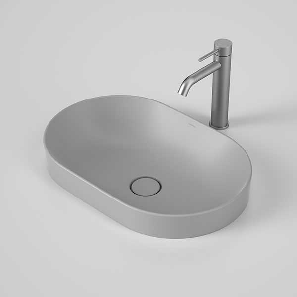 Caroma Liano II matte grey pill inset basin with oval shape and thin rim, shown with matching grey tapware and waste