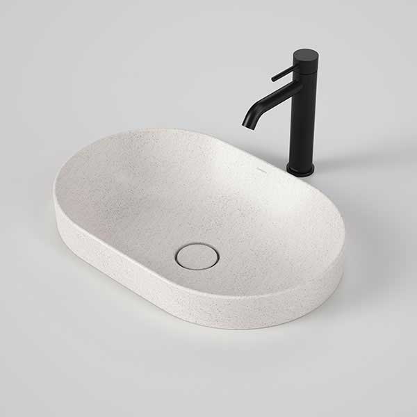 Caroma Liano II 530mm oval inset basin in matte speckled, with matching plug and waste, shown with black mixer tap