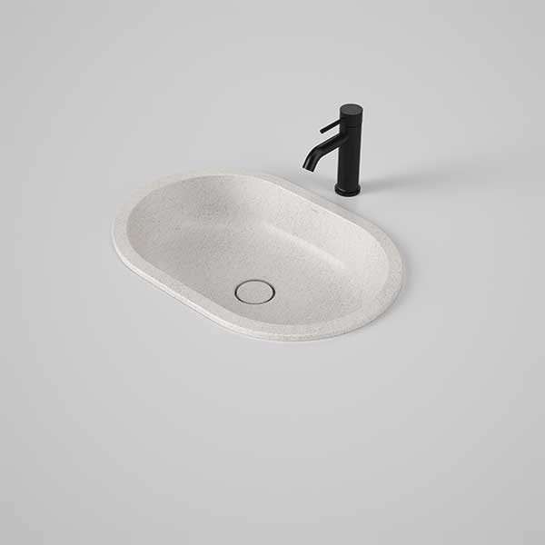 Caroma Liano II pill under counter basin in matte speckled finish, oval ceramic basin with black mixer tap and waste detail