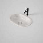 Caroma Liano II pill under counter basin in matte speckled finish, oval ceramic basin with black mixer tap and waste detail