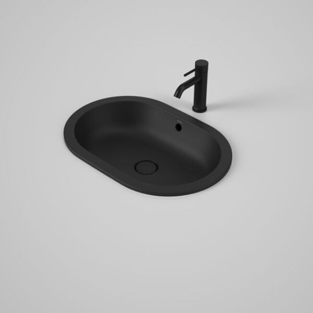 Caroma Liano II matte black oval basin with overflow and black mixer tap, under-counter view on white background