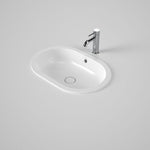 Caroma Liano II white oval under-counter basin with overflow and slim rim, shown with chrome mixer tap on a benchtop