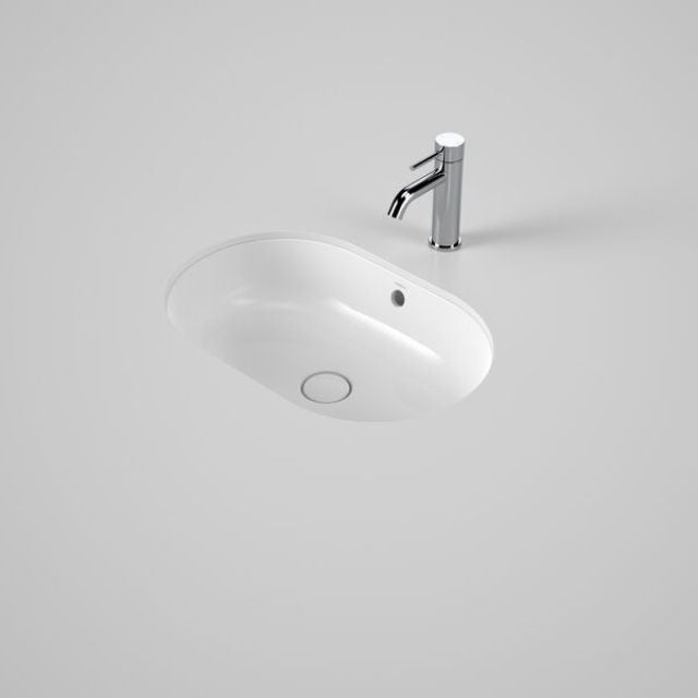 Caroma Liano II white oval under-counter basin with overflow and chrome mixer tap hole showing pill shape