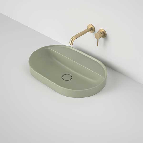 Caroma Liano II inset oval basin in matte green with tap landing and wall-mounted mixer, shown in a vanity setting