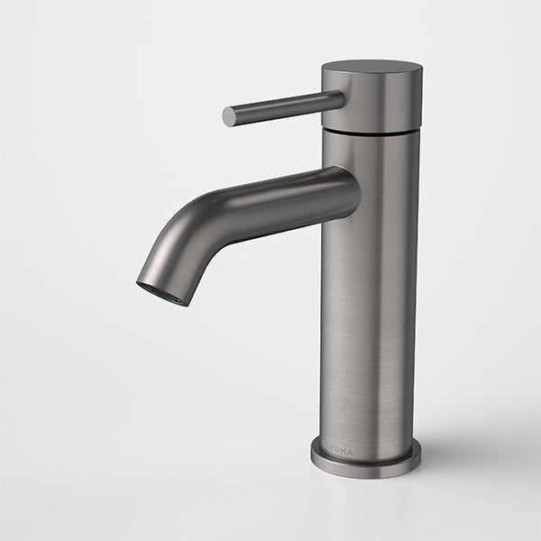 Caroma Liano II basin mixer tap in gunmetal finish, with slim cylindrical body and single lever handle, shown front on