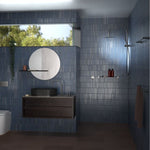 Caroma Liano II Chrome twin shower with overhead rain shower and hand shower in a blue tiled bathroom
