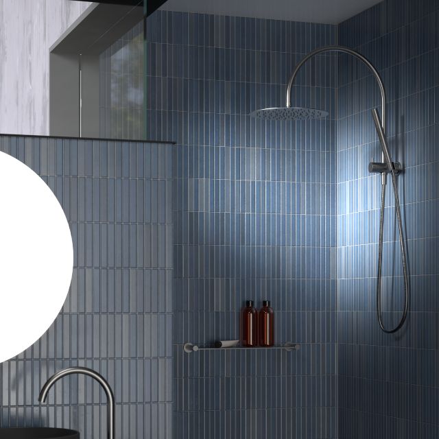 Caroma Liano II compact twin shower in chrome, with overhead rain shower and hand shower in a blue tiled bathroom