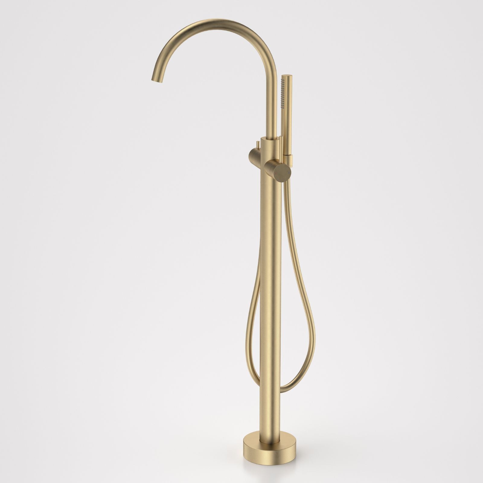 Caroma Liano II freestanding bath filler tap with hand shower in brushed brass, floor mounted with gooseneck spout and round base