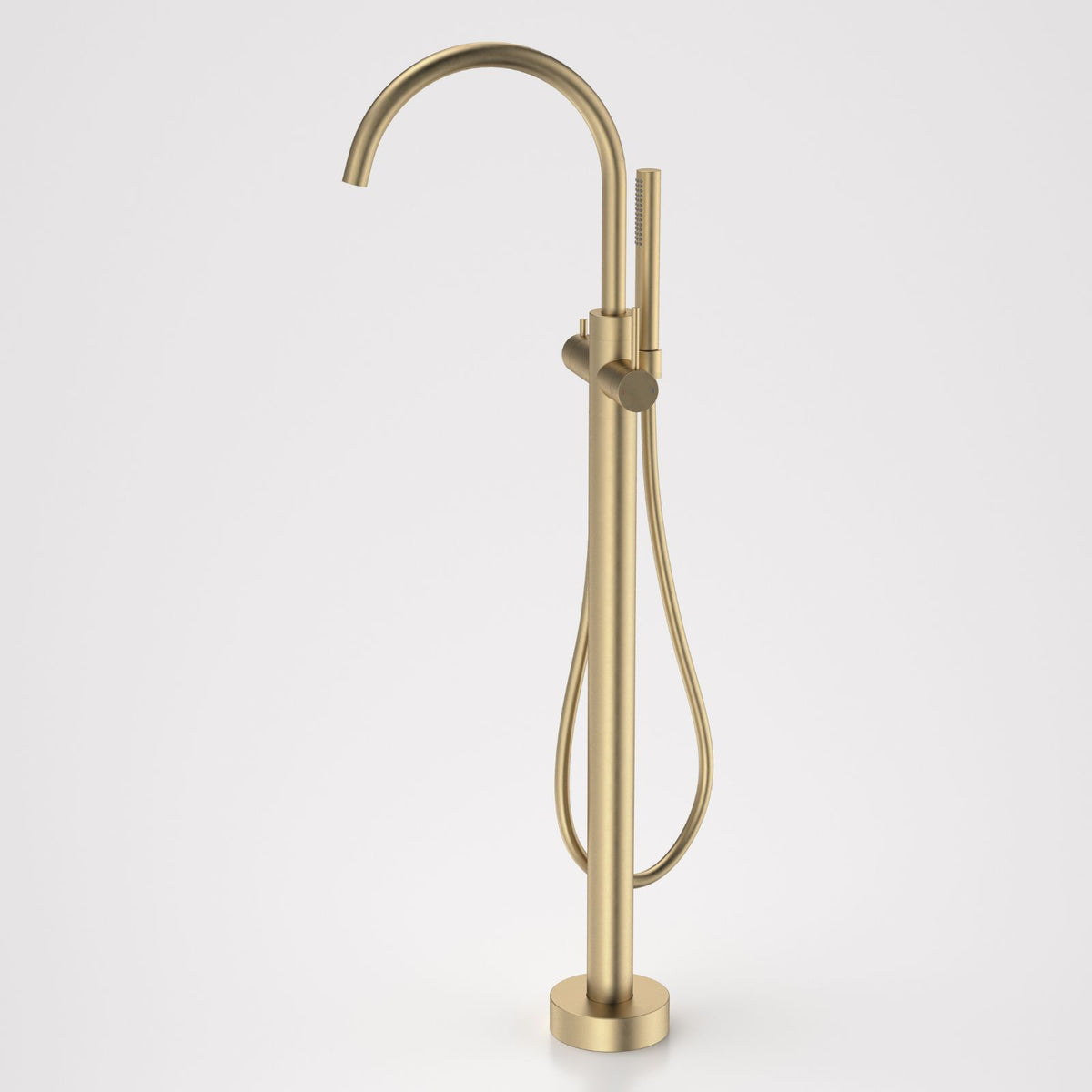 Caroma Liano II freestanding bath filler tap with hand shower in brushed brass, floor mounted with gooseneck spout and round base