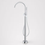 Caroma Liano II chrome freestanding bath filler with hand shower, floor-mounted gooseneck tap on white background