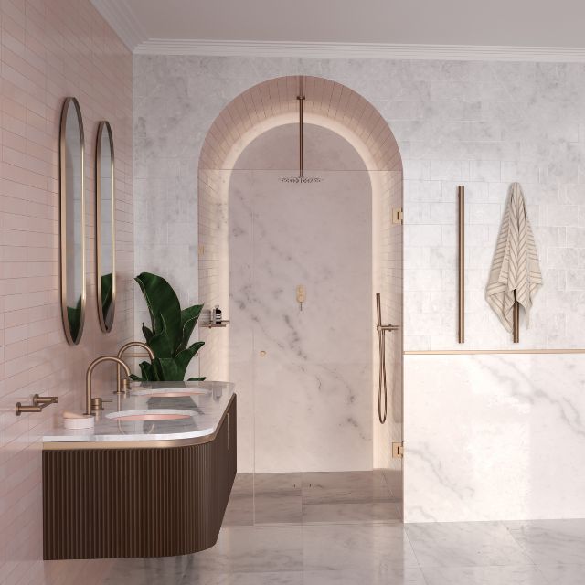 Caroma Liano II brushed bronze hand shower with hose in a stylish bathroom, shown in a wall-mounted shower setting