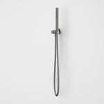 Caroma Liano II gunmetal hand shower with wall bracket and flexible hose on a plain white background