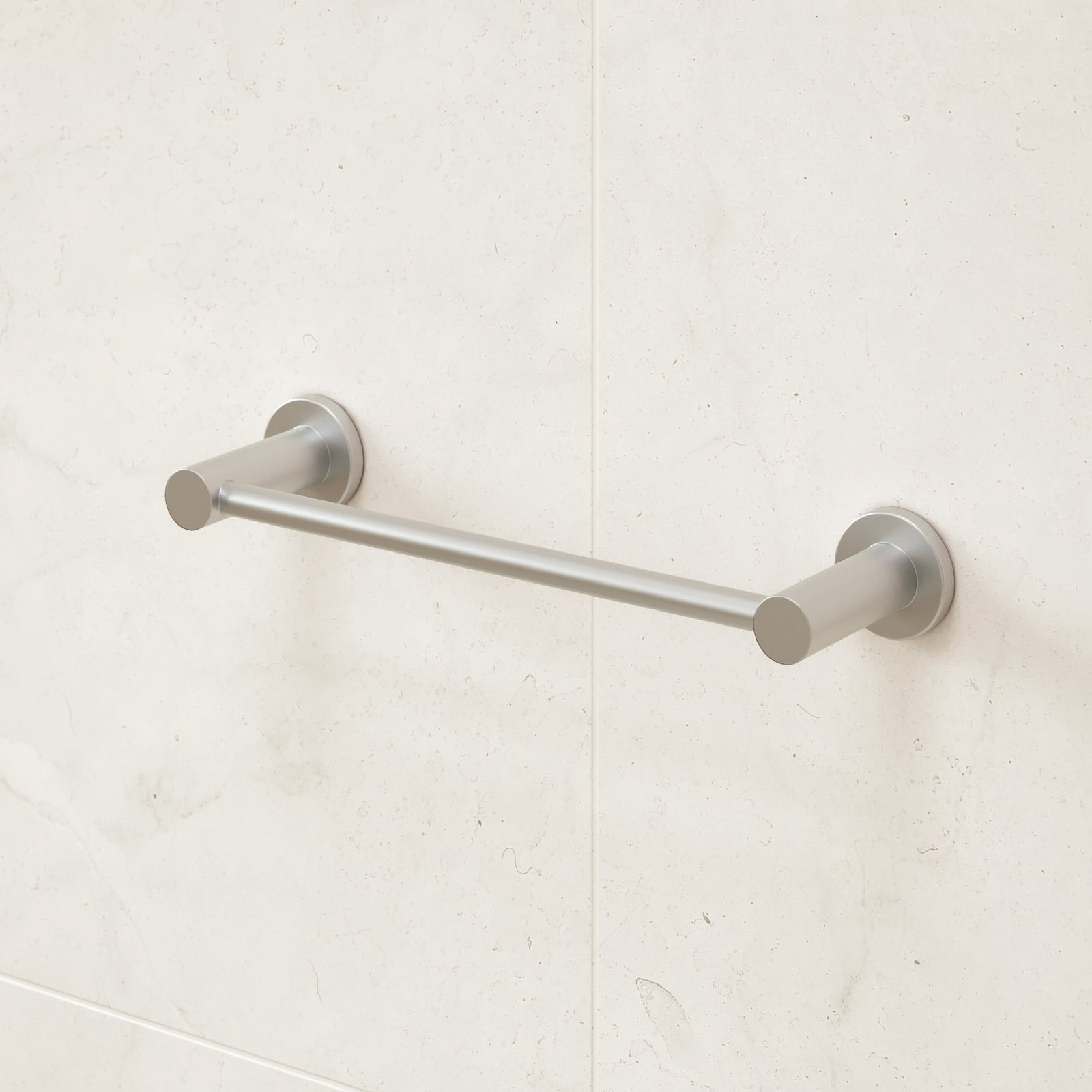 Caroma Liano II brushed nickel hand towel rail on a light tiled bathroom wall, with round wall fixings