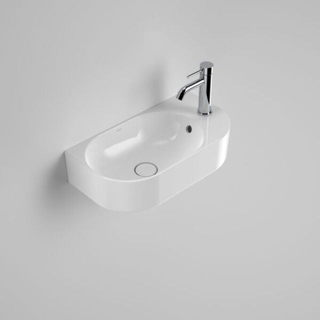 Caroma Liano II wall-hung white ceramic hand basin, oval with 1 tap hole and overflow, shown with chrome mixer tap