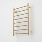 Caroma Liano II heated towel ladder in brushed brass, vertical wall-mounted rail with 8 bars
