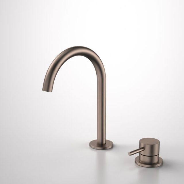 Caroma Liano II hob basin mixer set in brushed bronze, with arched outlet and separate hob-mounted mixer trim