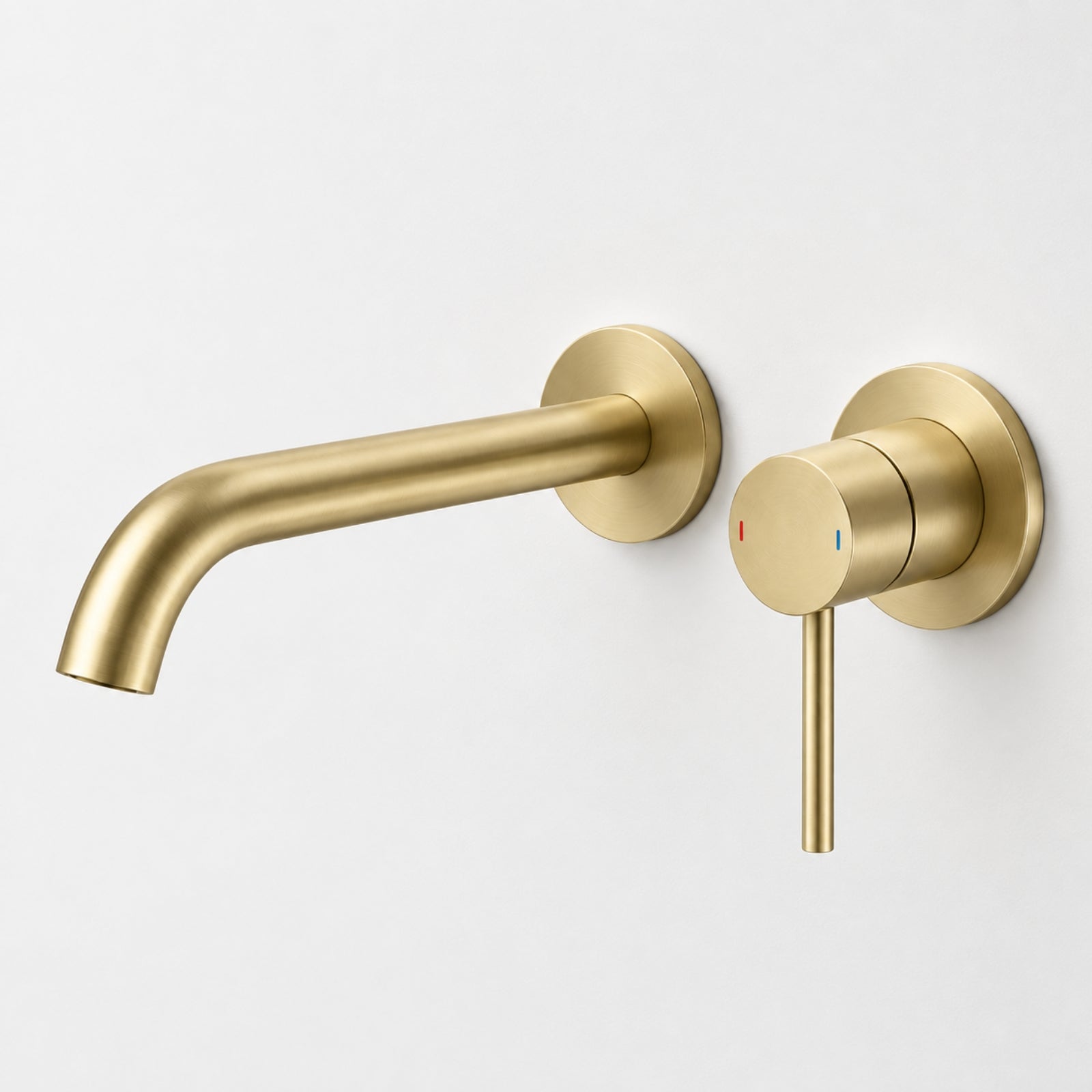 Caroma Liano II wall basin/bath mixer set in brushed brass, with round wall plates and lever handle