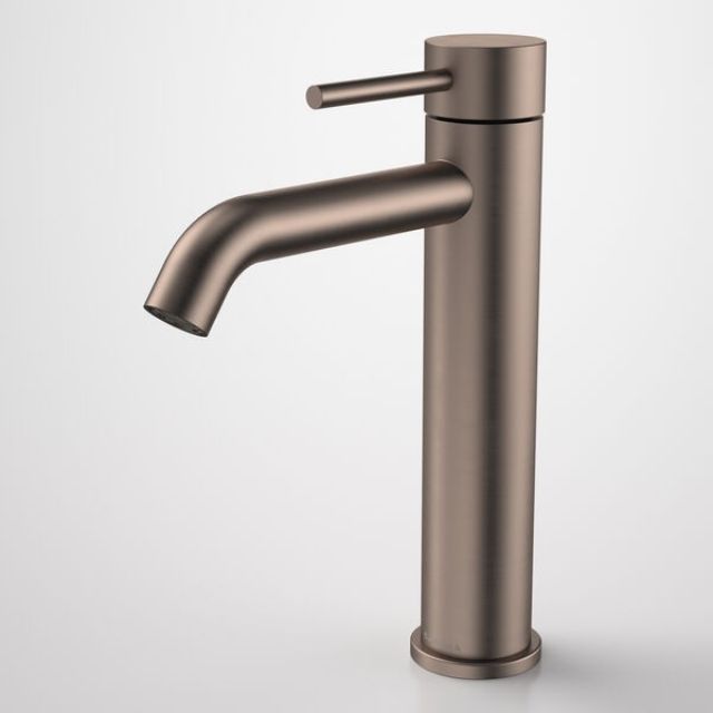 Caroma Liano II mid tower basin mixer in brushed bronze, with cylindrical body and curved spout, shown on white background
