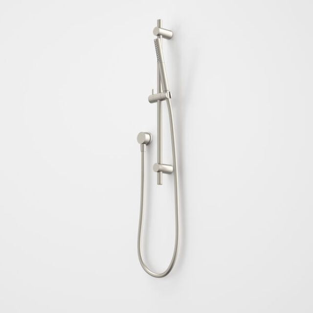 Caroma Liano II rail shower in brushed nickel with slide rail, handset and hose, wall mounted on white background