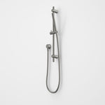 Caroma Liano II rail shower in gunmetal, wall-mounted with microphone handset and hose on a white background