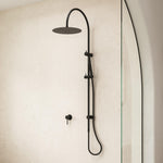 Caroma Liano II black rail shower with overhead rain showerhead and hand shower in a bathroom wall setting