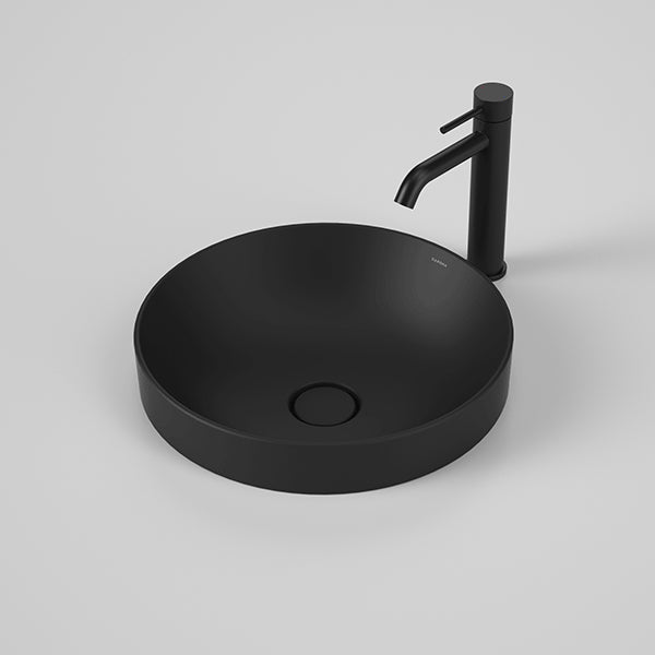 Caroma Liano II round inset basin in matte black with matching black mixer tap, front angled view on grey background