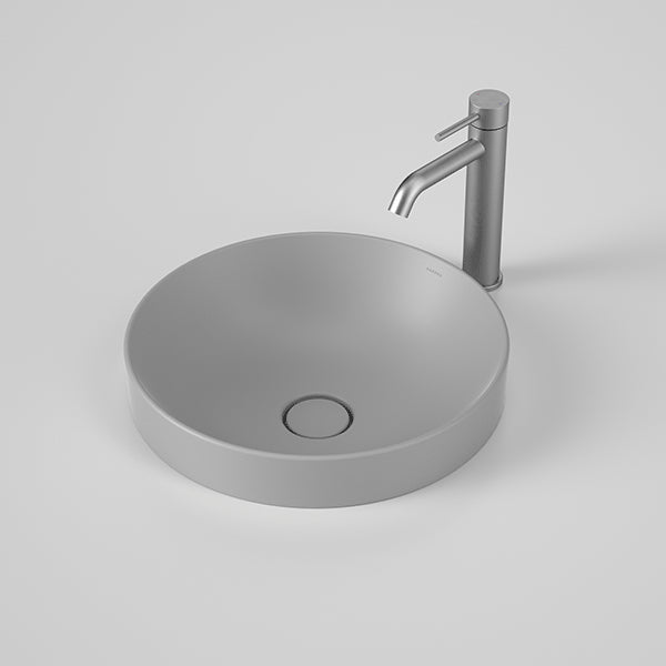 Caroma Liano II round inset basin in matte grey, with thin rim and matching grey pop-up waste, shown with tap