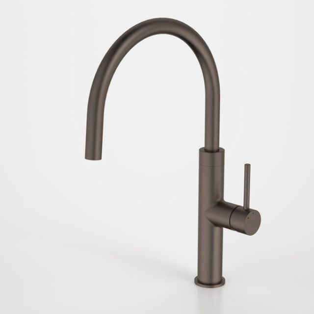 Caroma Liano II sink mixer in brushed bronze, with high arched spout and side lever handle, shown on white background
