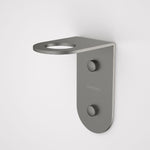 Caroma Liano II gunmetal soap bottle holder, wall-mounted stainless steel bathroom accessory with round opening