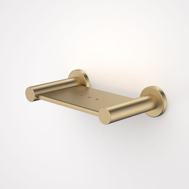 Caroma Liano II wall-mounted soap dish in brushed brass, with round wall plates and minimal stainless steel design