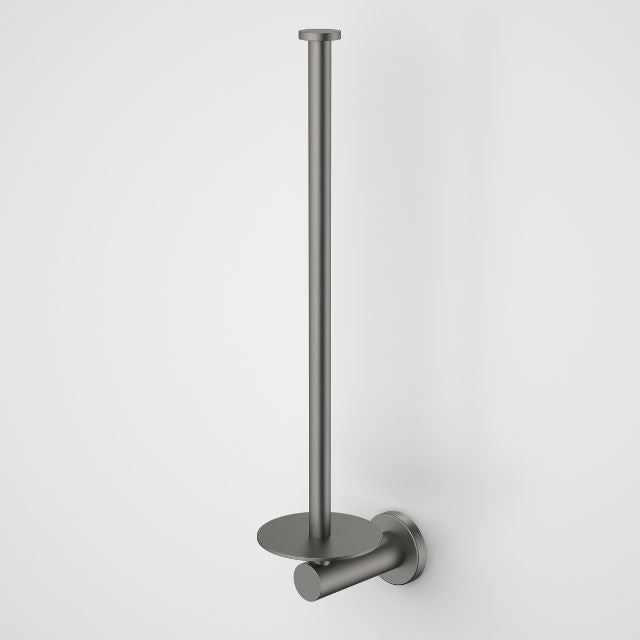 Caroma Liano II spare toilet roll holder in gunmetal, wall-mounted with minimalist round base and single post