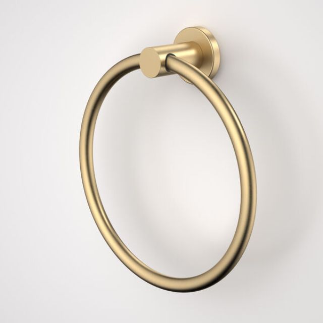 Caroma Liano II brushed brass towel ring with round wall plate, shown in side view against a white background