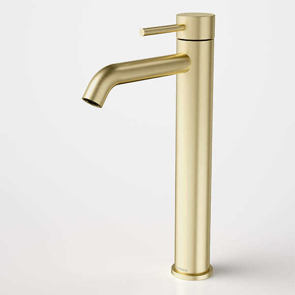 Caroma Liano II tower basin mixer in brushed brass, tall hob-mounted tap with slim spout and lever handle on white background