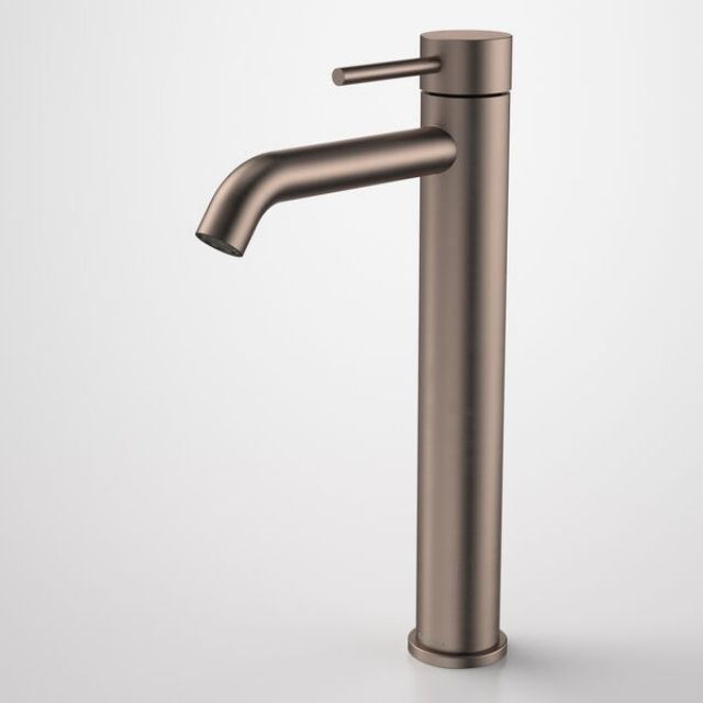 Caroma Liano II tower basin mixer in brushed bronze, tall single-lever tap with curved spout, front view on white background