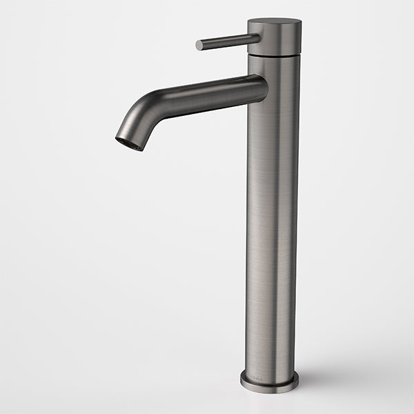 Caroma Liano II tower basin mixer in gunmetal, tall cylindrical tap with curved spout and side lever, front view