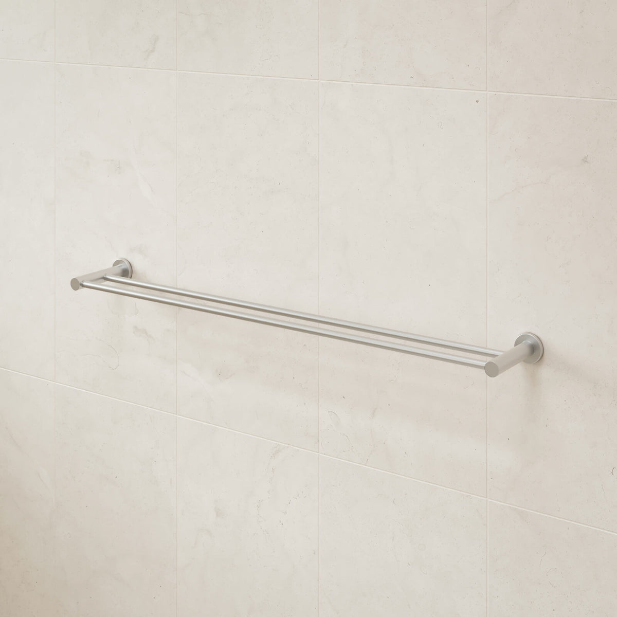 Caroma Liano II double towel rail in brushed nickel, wall-mounted on light tiled bathroom wall
