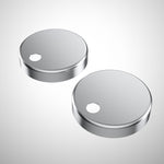 Caroma stainless steel toilet seat hinge caps, two round replacement caps on a white background