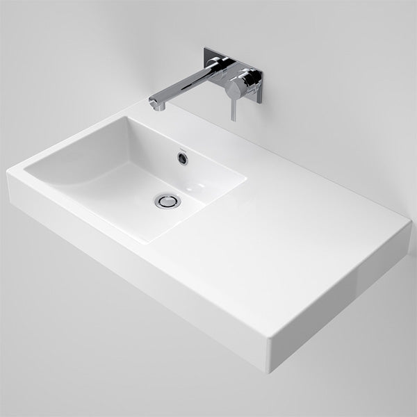 Caroma Liano Nexus white wall-hung rectangular basin with right-hand shelf, 750mm, shown in angled view with chrome wall mixer