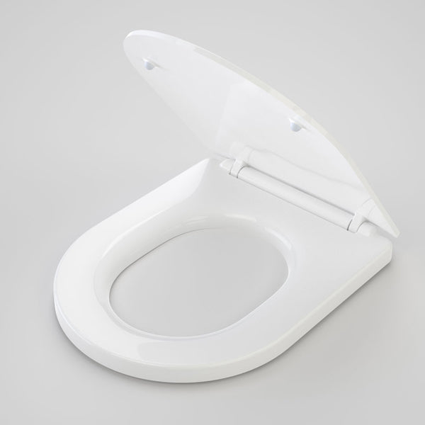 Caroma Liano soft close toilet seat in white, oval open lid with hinge detail on a light grey background