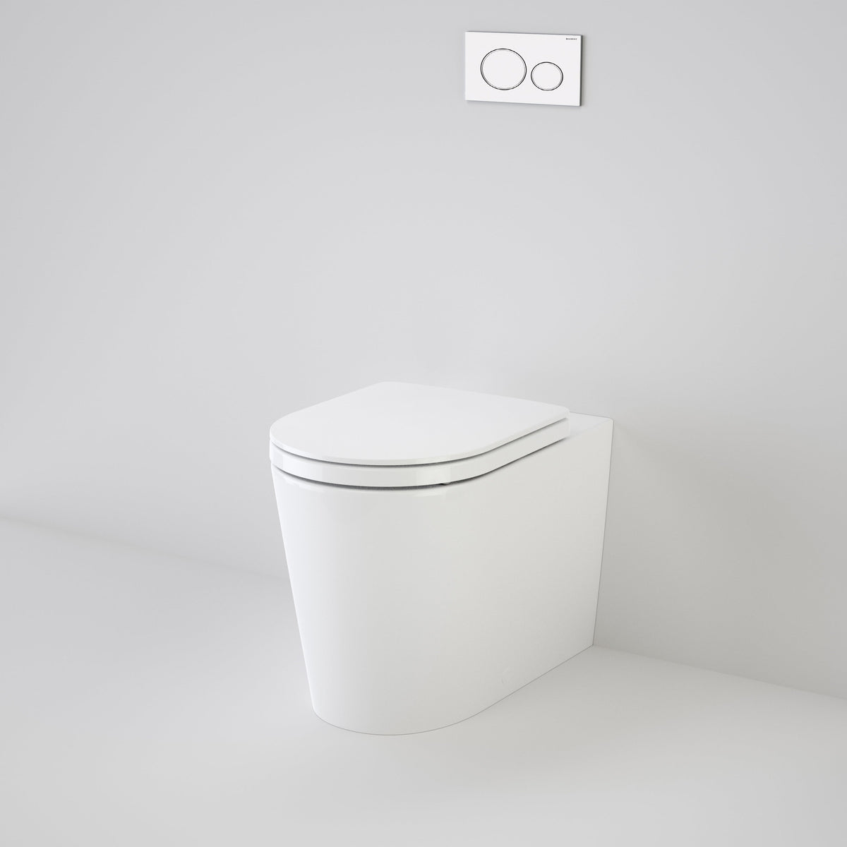 Caroma Liano Cleanflush white wall-faced toilet pan with concealed cistern and round flush plate, front view