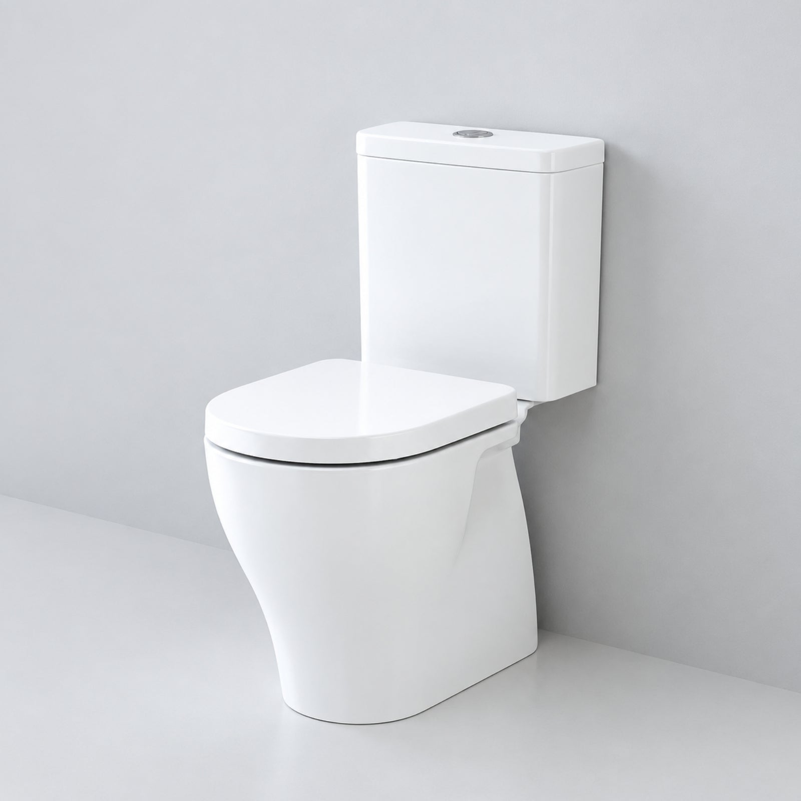 Caroma Luna Cleanflush close coupled toilet suite in white, front view with rimless pan and cistern against a grey wall
