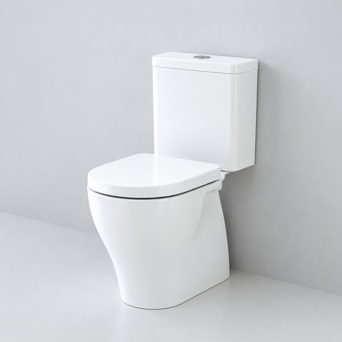 Caroma Luna Cleanflush close coupled toilet suite in white, front view with rimless pan and cistern against a grey wall