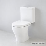 Caroma Luna Cleanflush close coupled toilet suite in white, shown in a P-trap side view against a grey wall