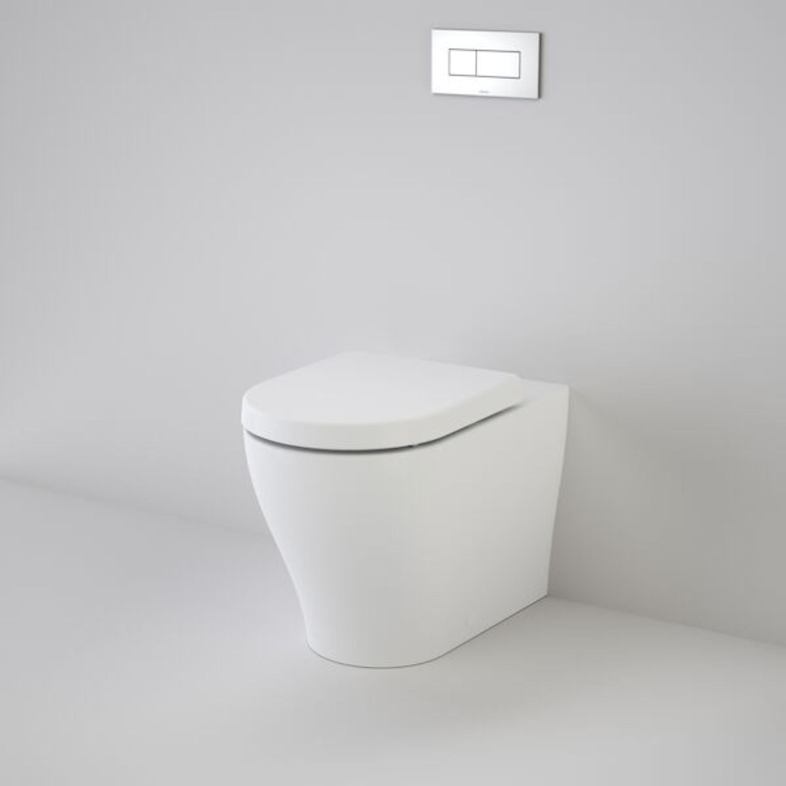Caroma Luna Cleanflush wall-faced toilet suite in white, with concealed cistern and flush plate on a grey bathroom wall