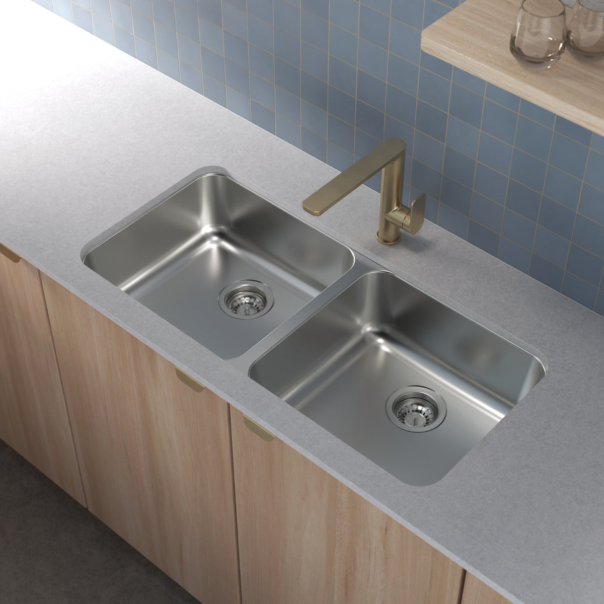 Caroma Luna II brushed brass sink mixer over a double kitchen sink in a modern benchtop setting