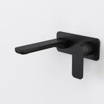 Caroma Luna II wall basin/bath mixer in satin black, with square backplate and long spout shown on white background