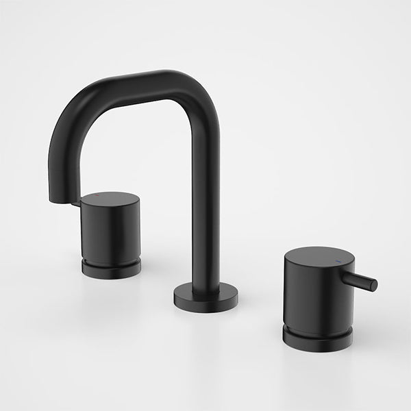 Caroma Luna black basin tap set with round lever handles and arched spout, three-piece hob-mounted bathroom taps
