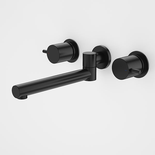 Caroma Luna black laundry tap set with wall-mounted swivel spout and two round lever handles