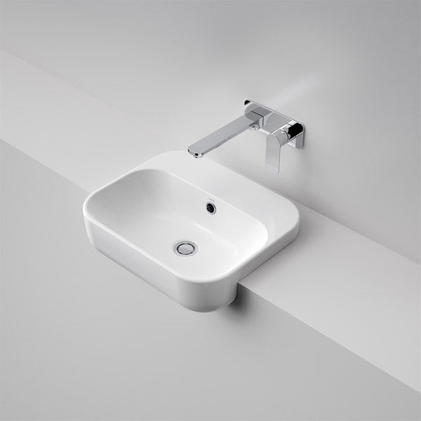 Caroma Luna semi recessed white ceramic basin with chrome wall tap, rectangular rounded design on a vanity bench